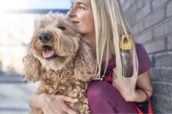 Woman hugging dog