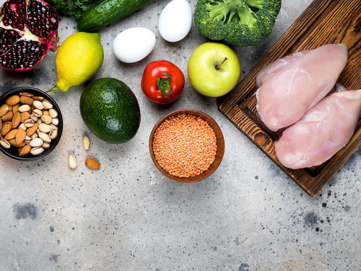 Ingredients: meat, vegetables, fruits and beans on a table
