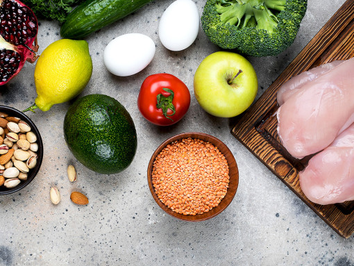 Ingredients: meat, vegetables, fruits and beans on a table